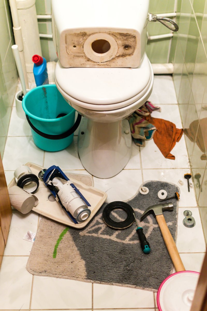 New toilet being installed in a Enfield bathroom